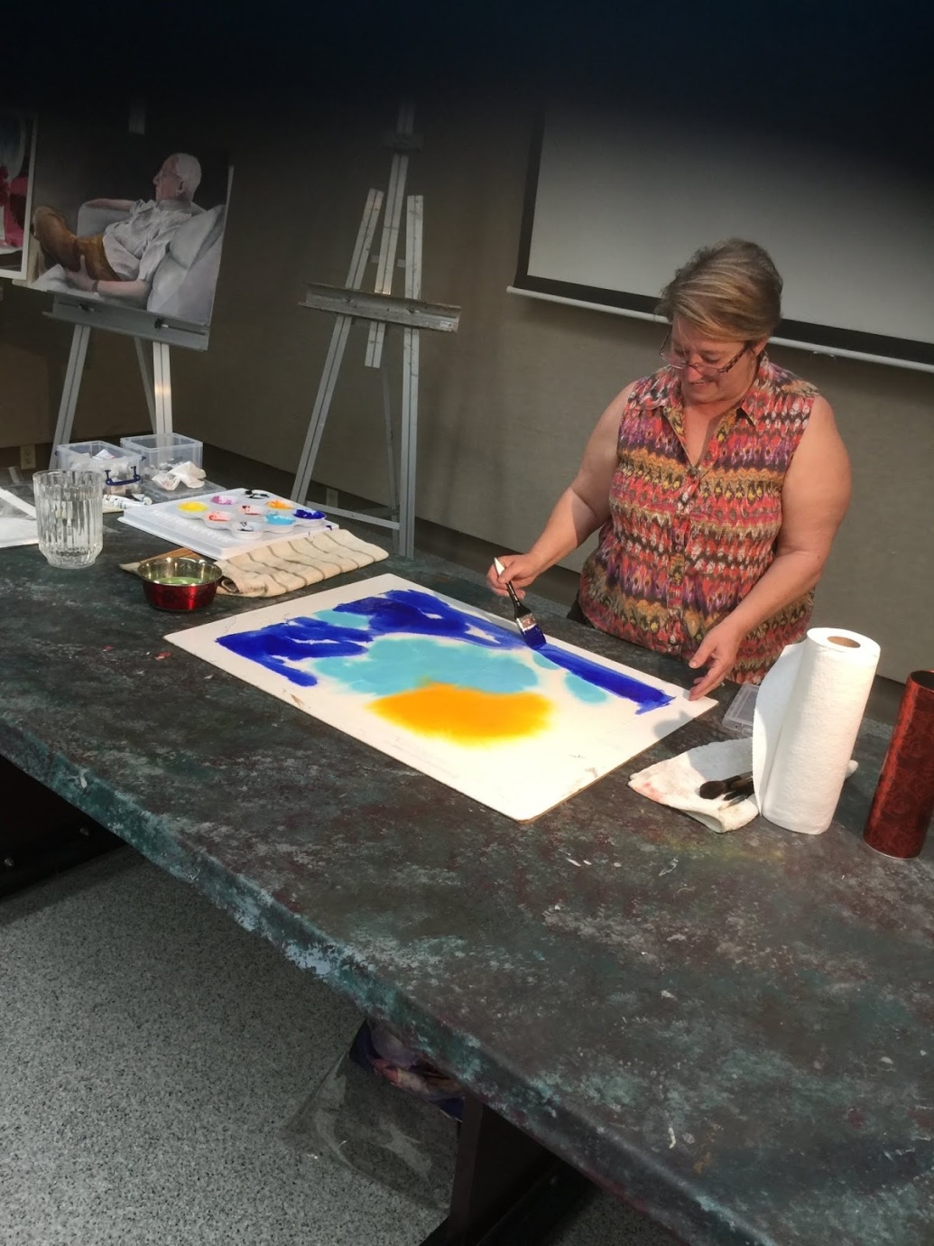 Debbie Cannatella working on a koi painting